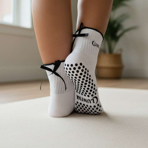 LUNIVA grip socks on yoga mat - front view