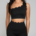 Professional black scalloped activewear on grey background