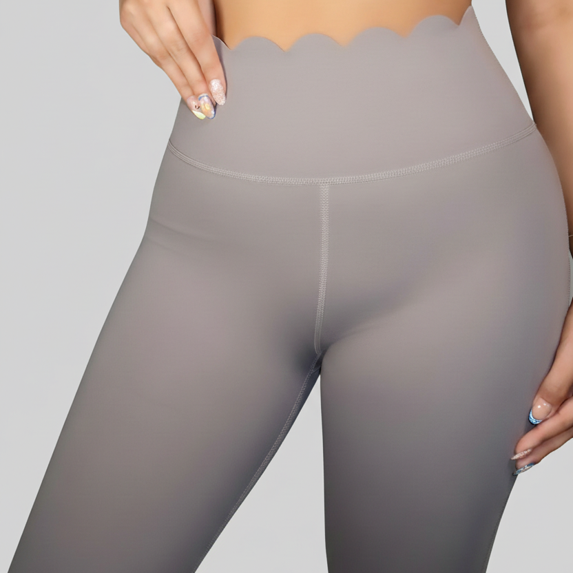 Professional grey scalloped leggings detail on grey background