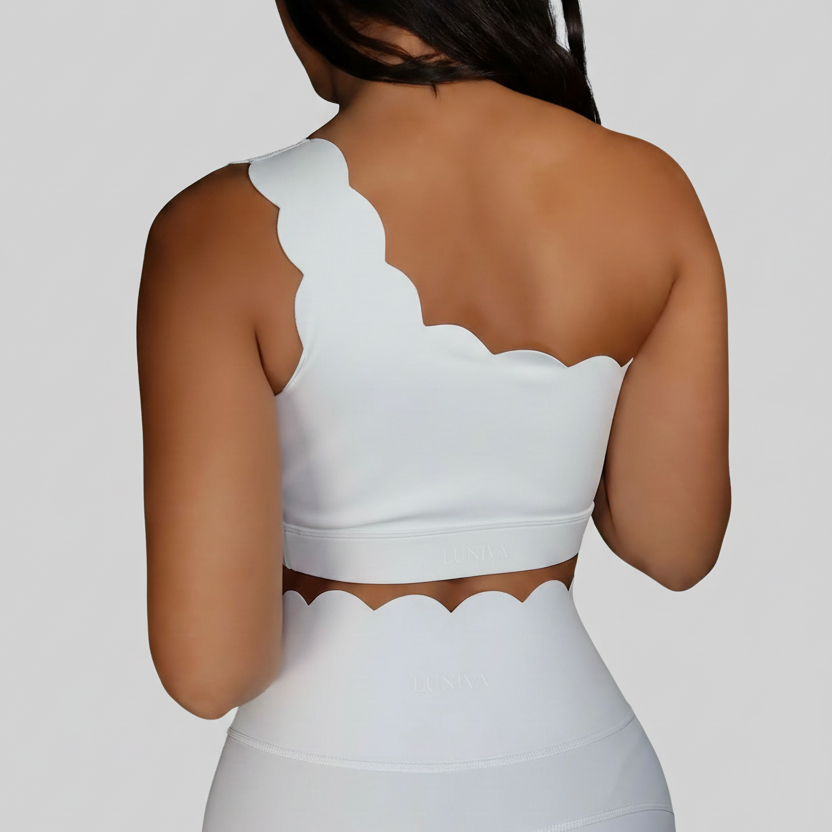 Professional white scalloped activewear back view on grey background