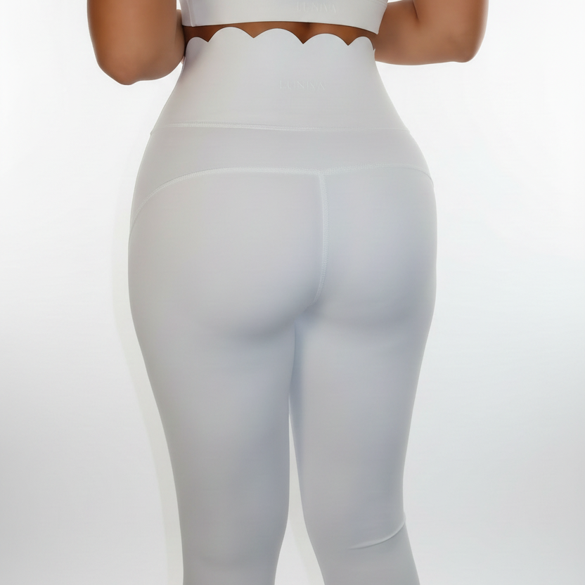 Professional white scalloped activewear back view on grey background