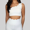 Professional white scalloped activewear on grey background