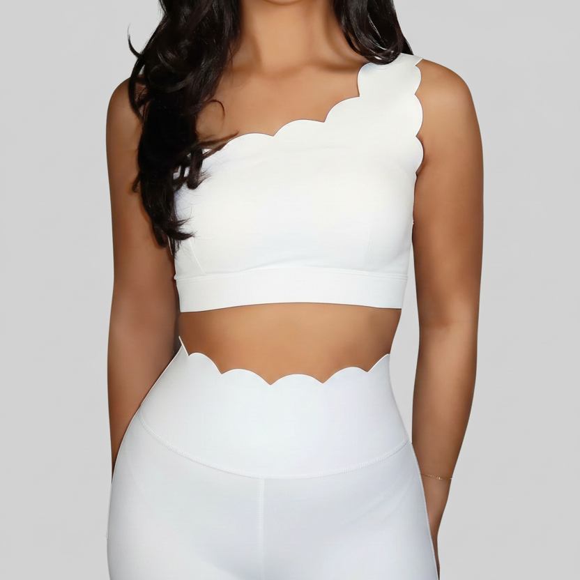 Professional white scalloped activewear on grey background